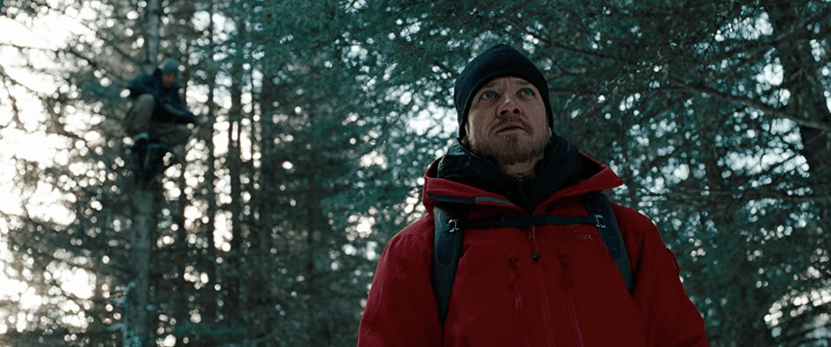 Outcome Agents #3 (Oscar Isaac, in a tree) and #5 (Jeremy Renner) in Alaska. in "The Bourne Legacy." (Universal Pictures)