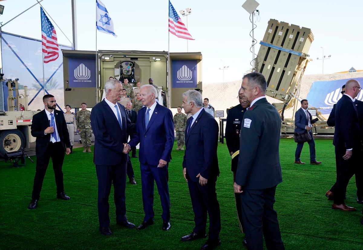 Biden Shakes Hands, Hugs Woman After White House Said He‘d ’Minimize Contact' in Israel
