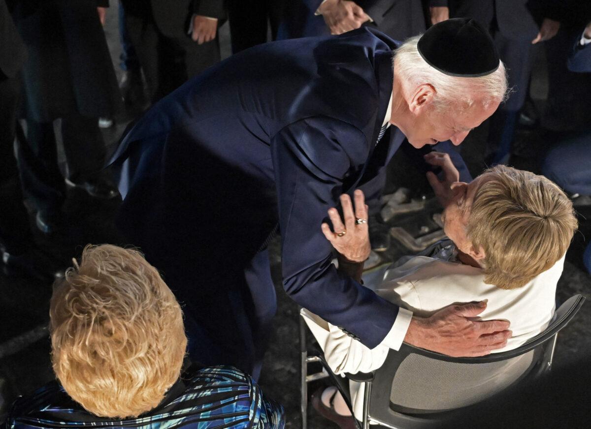 U.S. President Joe Biden embraces Holocaust survivor Giselle Cycowicz during a ceremony at the Hall of Remembrance of the Yad Vashem Holocaust Memorial Museum in Jerusalem, on July 13, 2022. (Debbie Hill/Pool/AFP via Getty Images)