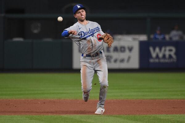 Trea Turner #6 of the Los Angeles Dodgers throws to first base for an out against the St. Louis Cardinals in the seventh inning at Busch Stadium, in St Louis, on July 13, 2022. (Joe Puetz/Getty Images)