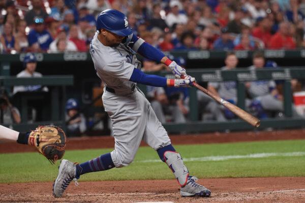 Mookie Betts #50 of the Los Angeles Dodgers hits an RBI double against the St. Louis Cardinals in the eighth inning at Busch Stadium, in St Louis, on July 13, 2022. (Joe Puetz/Getty Images)