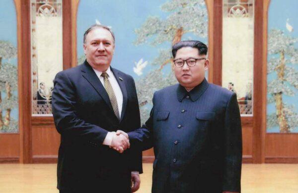 In this undated file photo that was provided by the White House, CIA director Mike Pompeo (L) shakes hands with North Korean leader Kim Jong Un in Pyongyang, North Korea. (The White House via Getty Images)