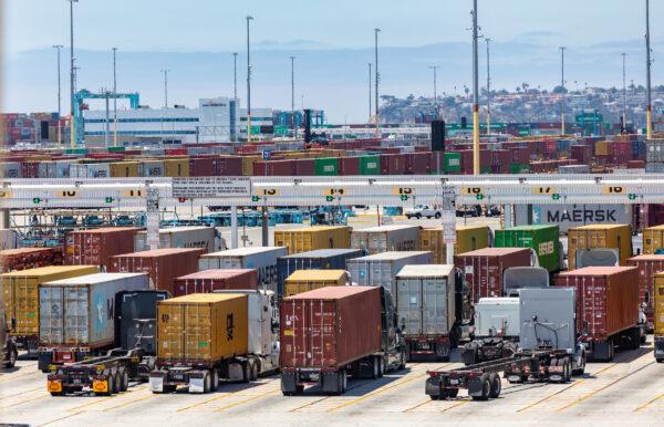 Trucks wait for shipping containers at the Port of Long Beach, Calif., on July 13, 2022. (John Fredricks/The Epoch Times)