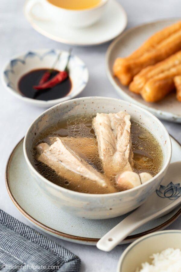 Bak kut teh is a clear peppery soup featuring pork ribs. (delightfulplate.com)