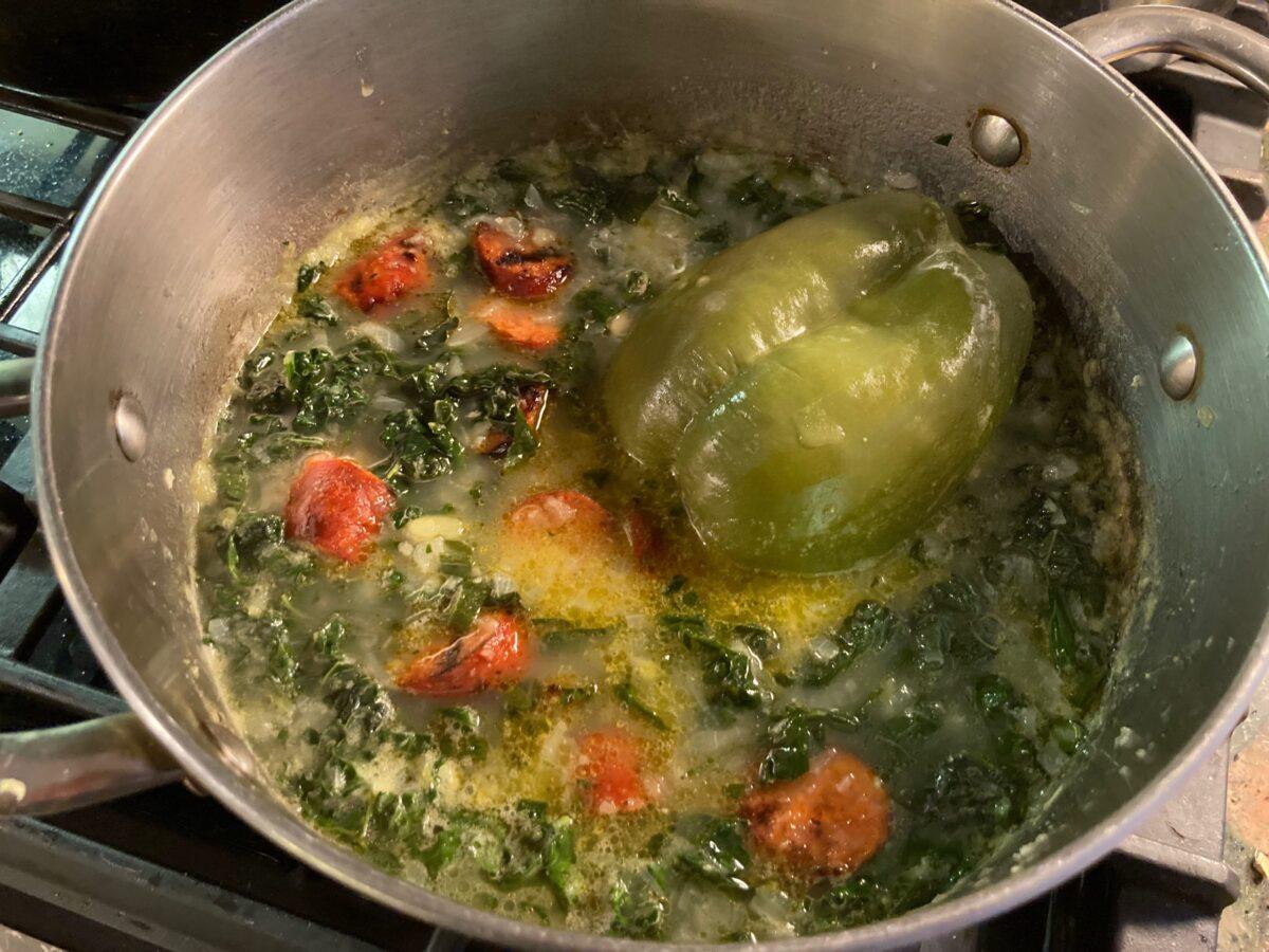 A whole bell pepper adds its inimitable fragrance to a pot of caldo verde. (Ari LeVaux)