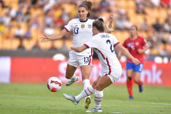 Ashley Sanchez of USA kicks the ball and scores her team's third goal while observed by teammate Alex Morgan during the semifinal between United States and Costa Rica as part of the 2022 Concacaf W Championship at Universitario Stadium, in Monterrey, Mexico, on July 14, 2022. (Azael Rodriguez/Getty Images)