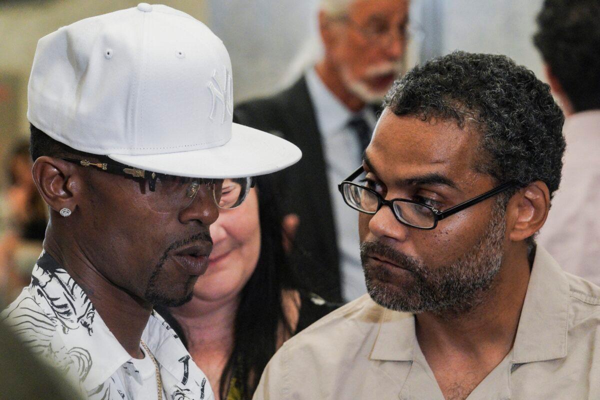 Vincent Ellerbe (L) and Thomas Malik (R) talk with press following their exoneration hearing at Brooklyn Supreme Court in New York on July 15, 2022. (Bebeto Matthews/AP Photo)