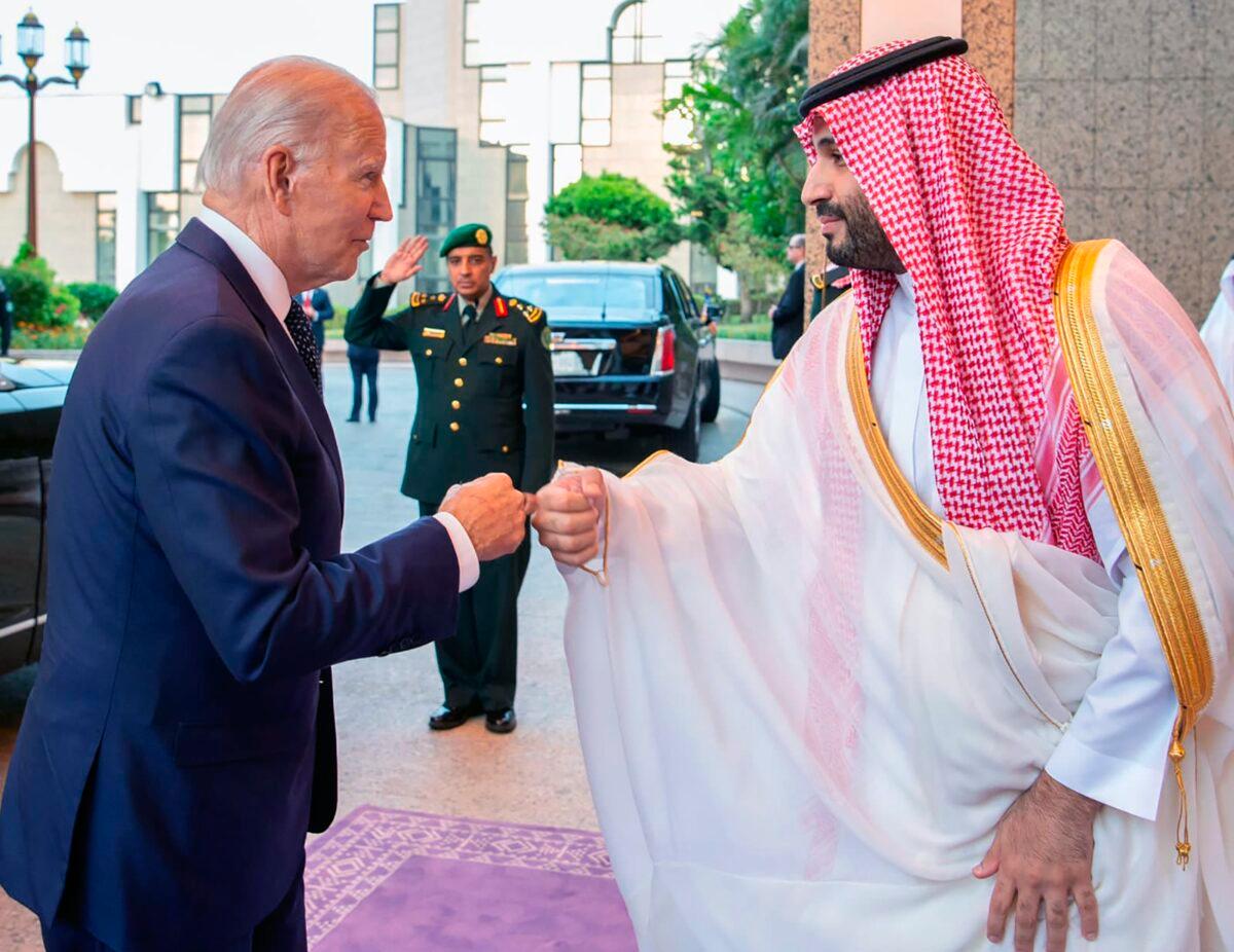 Saudi Crown Prince Mohammed bin Salman (R) greets U.S. President Joe Biden with a fist bump after his arrival in Jeddah, Saudi Arabia, on July 15, 2022. (Bandar Aljaloud/Saudi Royal Palace via AP)