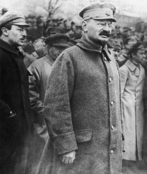 Revolutionary leader and author Leon Trotsky walks in a crowd of people outdoors during the Russian Revolution, Soviet Union, circa 1917. (Hulton Archive/Getty Images)