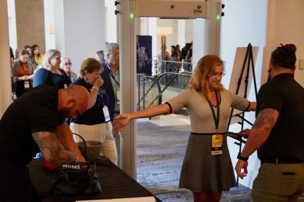 Attendees at the Moms for Liberty conference pass through security in the Tampa hotel hosting the first day of the event on July 15, 2022. (Nanette Holt/The Epoch Times)