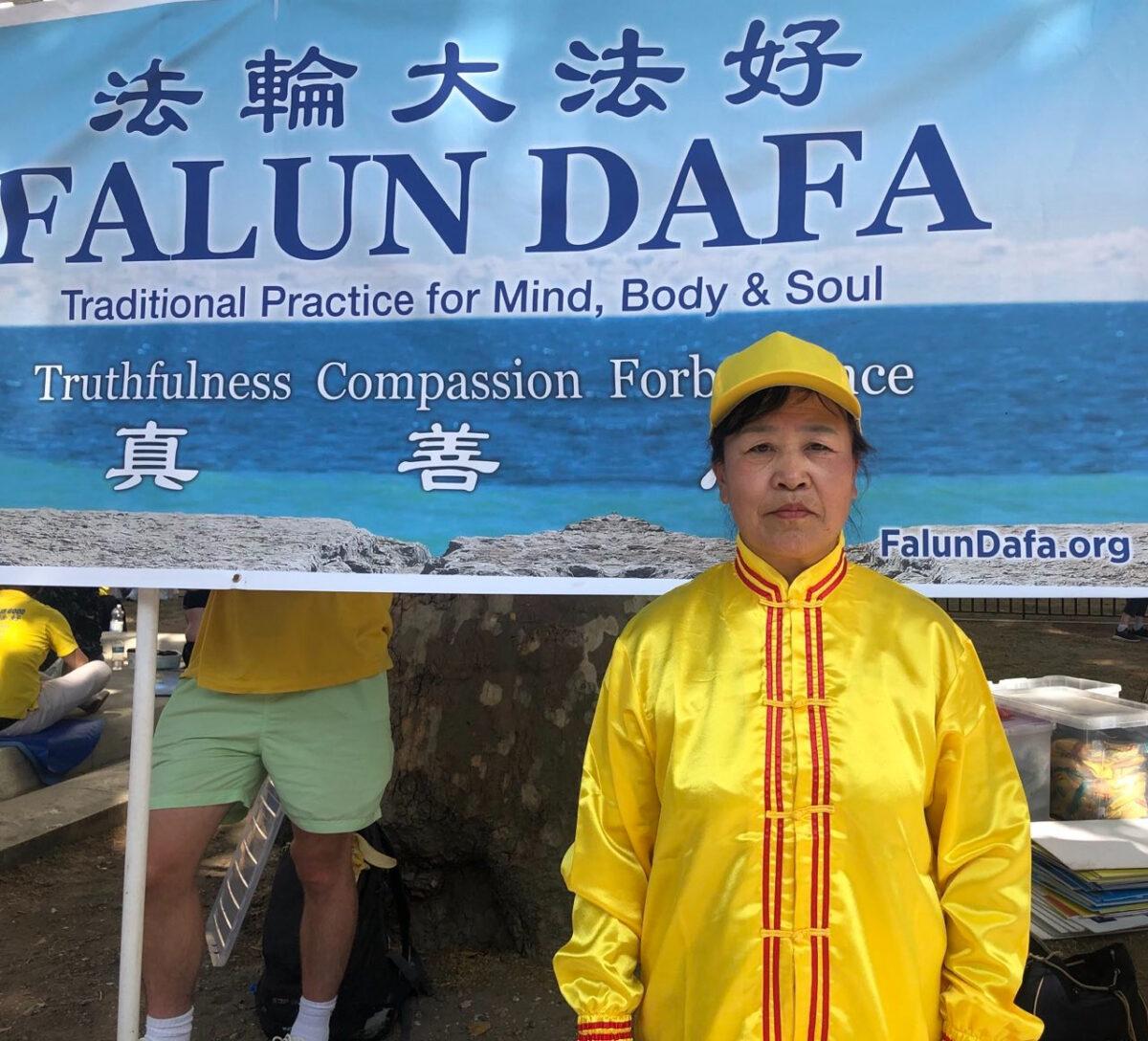 Falun Gong practitioner Yong Li at a rally highlighting the 23rd year of persecution in China against the spiritual discipline, in London on July 16, 2022. (Jack Sun/The Epoch Times)