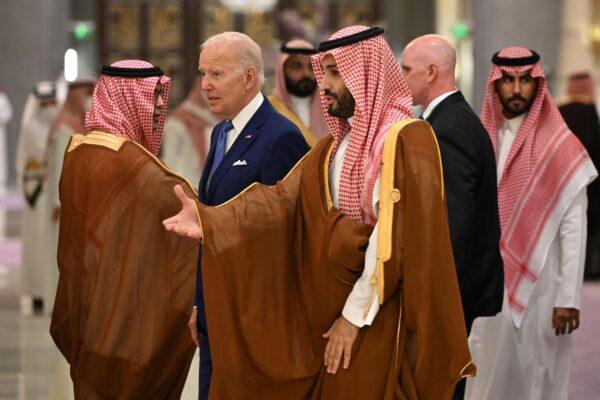 President Joe Biden (center L) and Saudi Crown Prince Mohammed bin Salman (C) arrive for the family photo during the "GCC+3" (Gulf Cooperation Council) meeting at a hotel in Saudi Arabia's Red Sea coastal city of Jeddah on July 16, 2022. (Mandel Ngan/Pool Photo via AP)