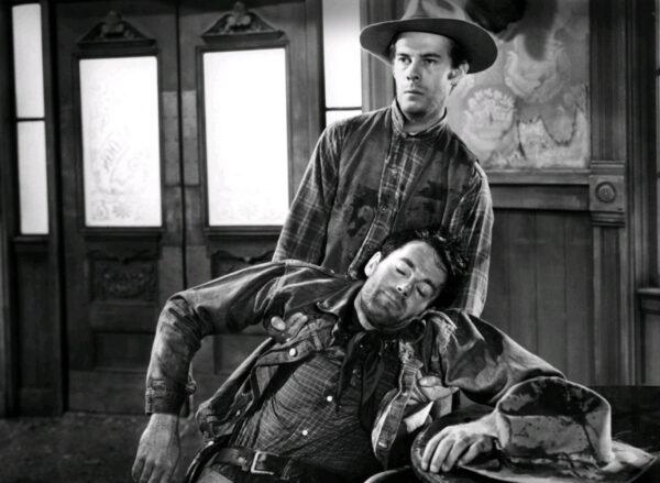 Art Croft (Harry Morgan, R) helping his drunk friend Gil Carter (Henry Fonda), in “The Ox-Bow Incident.” (20th Century Fox)