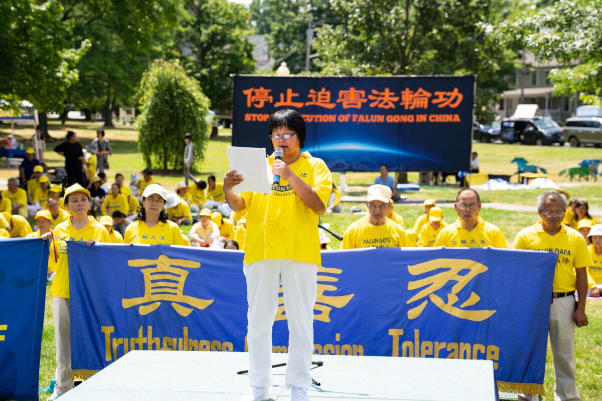 Xia Haizhen speaks about her experience being tortured in a Chinese prison because of her faith in Falun Gong, at a rally in Goshen, N.Y., on July 17, 2022. Falun Gong adherents have been persecuted in China for nearly 23 years. (Larry Dye/The Epoch Times)