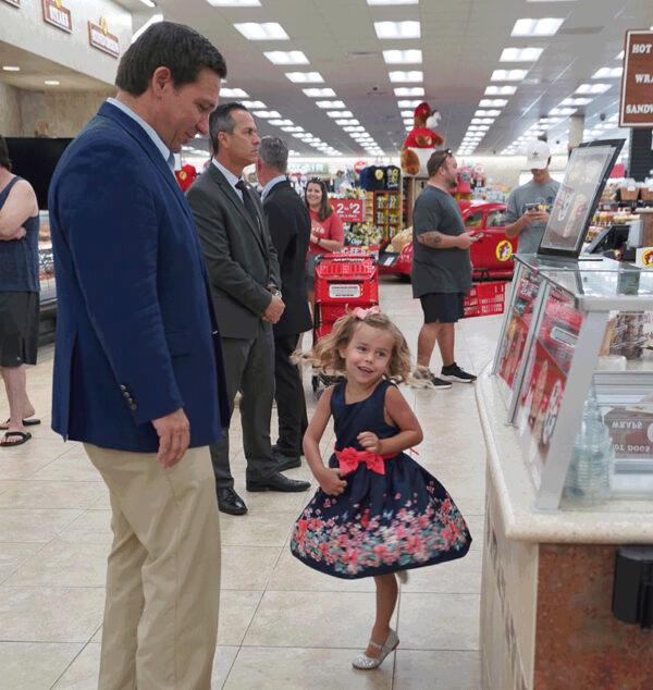 Fla. Gov. Ron DeSantis and his oldest child, Madison, stop at Buc-ee's for cotton candy-flavored Dippin' Dots ice cream on Aug. 19, 2021. (Screenshot/Twitter)