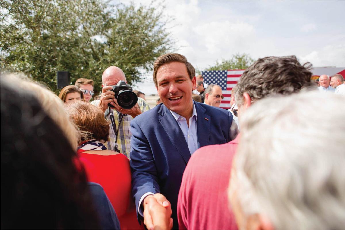 Florida Gov. Ron DeSantis shakes hands with supporters of his reelection campaign, in an undated photo. (Courtesy of Ron DeSantis for Governor)