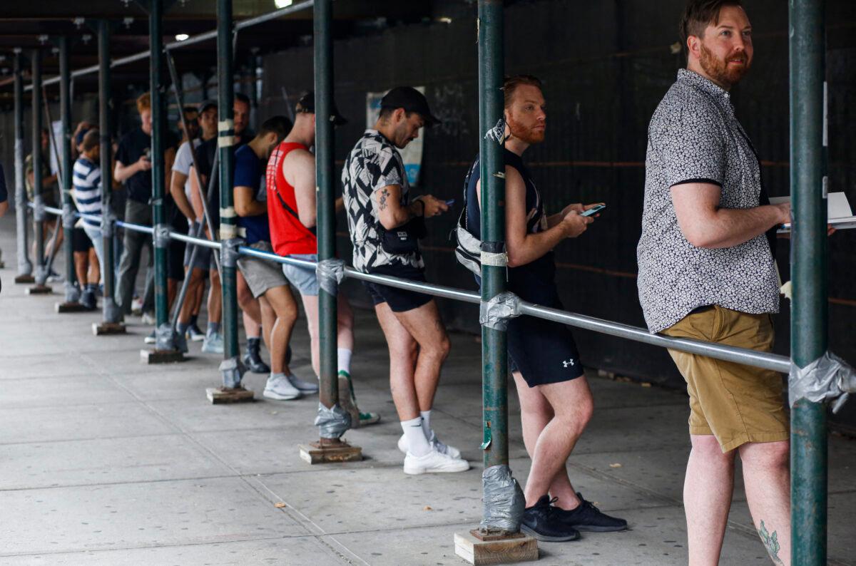 People wait in line to recieve the Monkeypox vaccine before the opening of a new mass vaccination site at the Bushwick Education Campus in Brooklyn in New York City on July 17. (Kena Betancur/AFP via Getty Images)