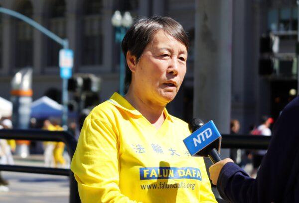 Sandy Wang speaks to NTD Television during the rally in San Francisco on July 16, 2022. (Cynthia Cai/The Epoch Times)