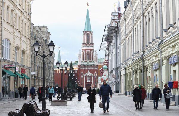 People walk along a shopping street near the gates of the Kremlin in Moscow, in a file photo. (Andreas Rentz/Getty Images)