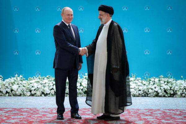 Russian President Vladimir Putin (L) and Iranian President Ebrahim Raisi meet before a summit in Tehran, Iran, on July 19, 2022. (President Website/WANA (West Asia News Agency)/Handout via Reuters)
