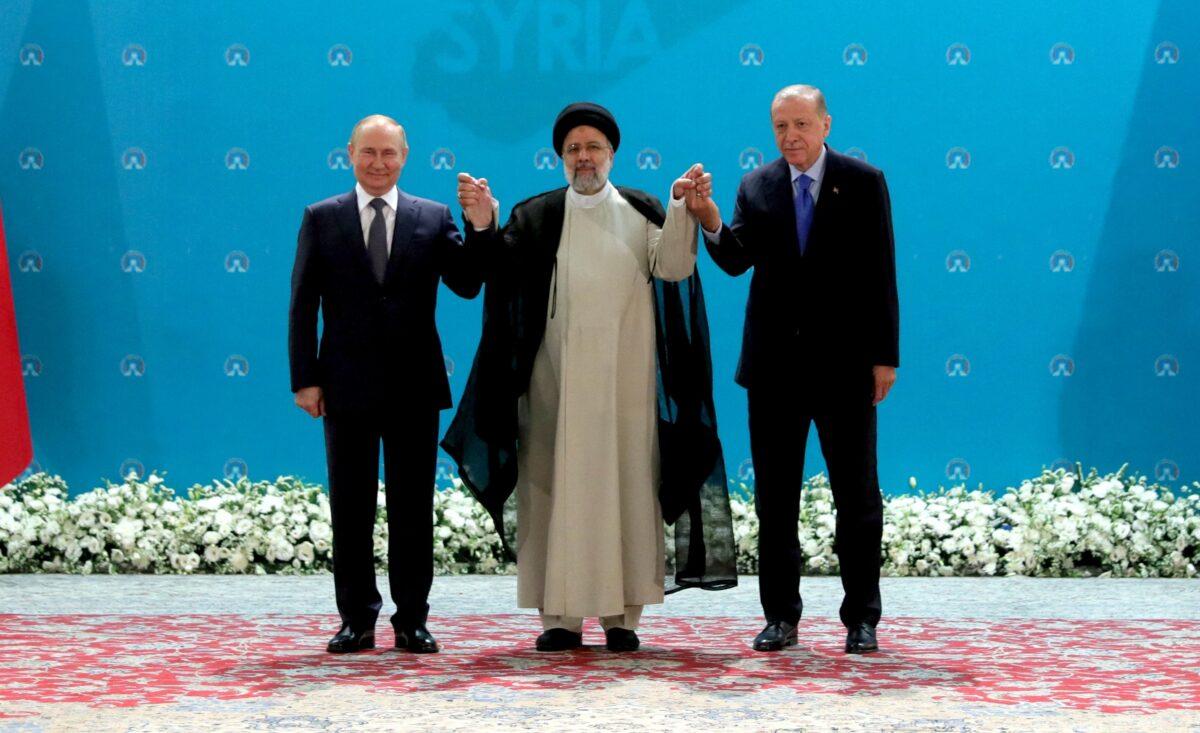 (L–R) Russian President Vladimir Putin, Iranian President Ebrahim Raisi, and Turkish President Tayyip Erdogan meet in Tehran, Iran, on July 19, 2022. (Turkish Presidential Press Office/Handout via Reuters)