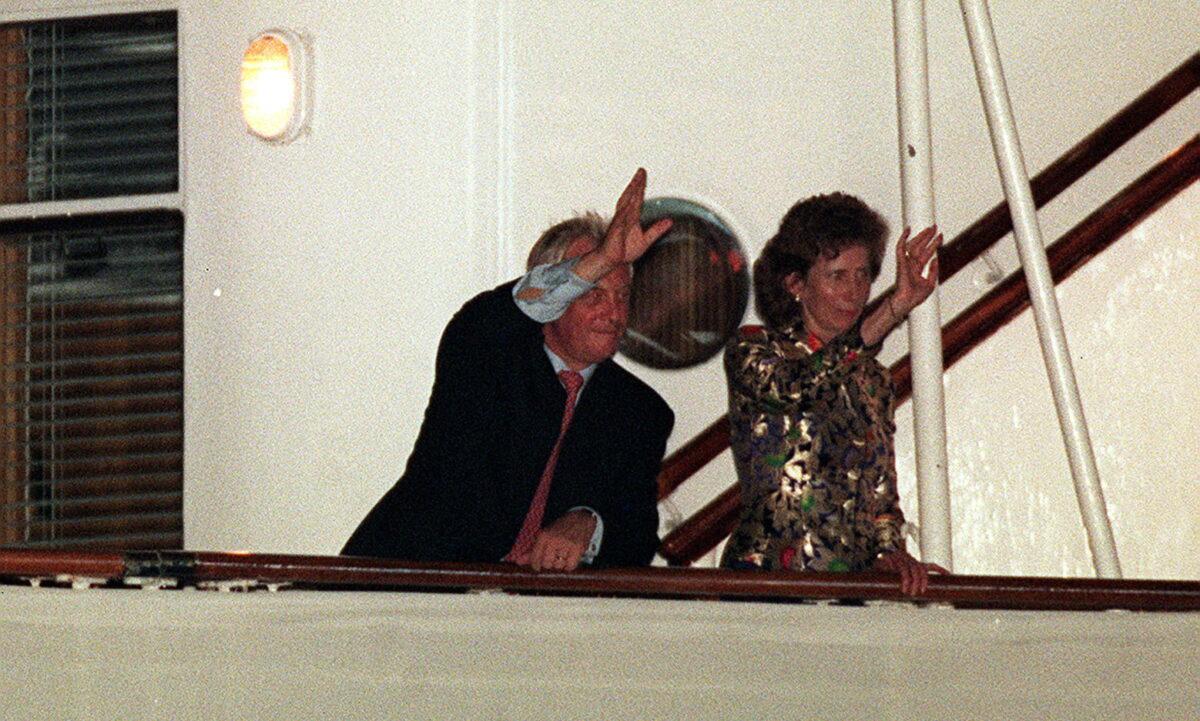 Chris Patten, the last British governor of Hong Kong, waves to wellwishers as he leaves on the Royal Yacht Britannia on June 30, 1997. (John Stillwell/PA Media)