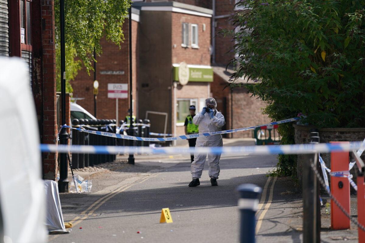 A forensic officer near the scene after nine-year-old Lilia Valutyte was stabbed to death in Boston, Lincolnshire, England, on July 29, 2022. (Joe Giddens/PA Media)