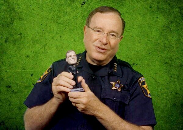  Sheriff Grady Judd holds a bobblehead of his likeness given to him by his staff. (Polk County Sheriff's Office via AP)