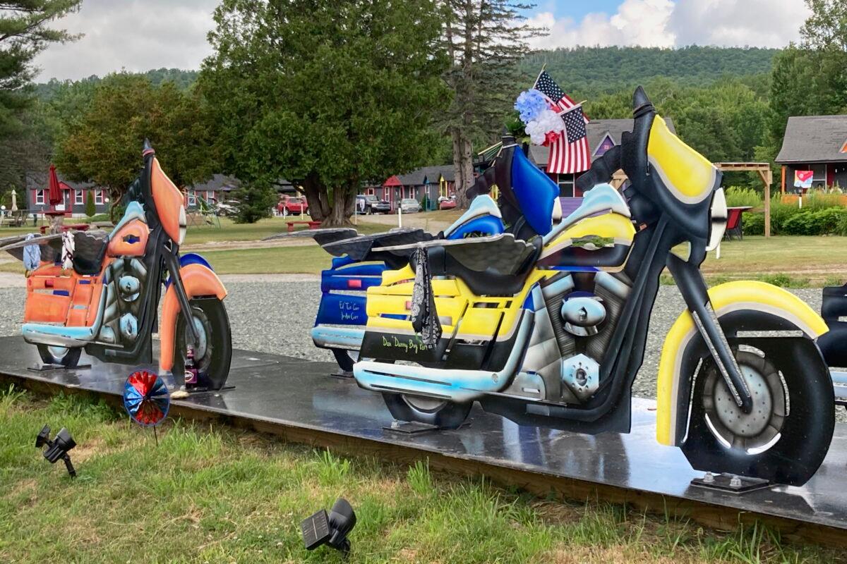 Motorcycle likenesses, part of a memorial to honor members of the Jarheads Motorcycle Club killed in a nearby crash, are visible on the roadside in Randolph, N.H., on July 13, 2022. (Kathy McCormick/AP Photo)