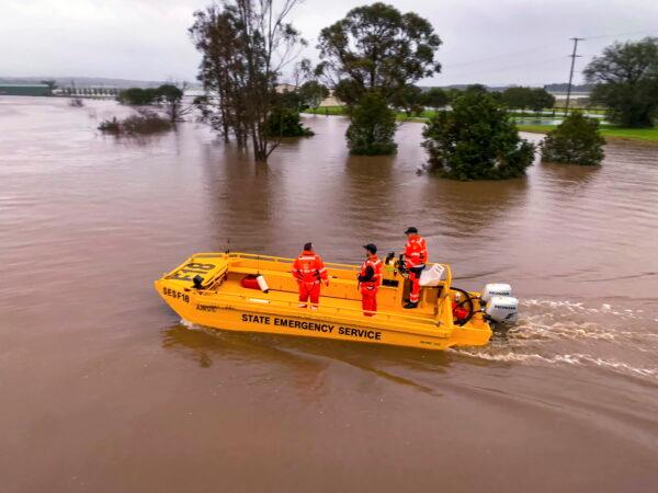 A boat patrols the Hunter River near Hinton, Australia on July 6, 2022. (State Emergency Service via AP)