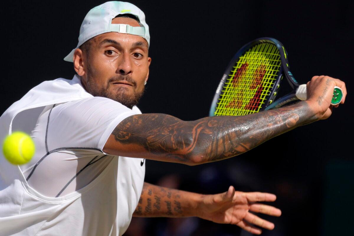 Australia's Nick Kyrgios returns to Serbia's Novak Djokovic during the final of the men's singles on day fourteen of the Wimbledon tennis championships in London on July 10, 2022. (Kirsty Wigglesworth/AP Photo)
