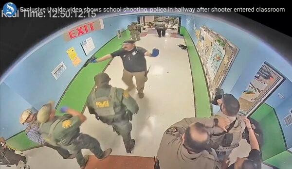 In this photo from surveillance video provided by the Uvalde Consolidated Independent School District via the Austin American-Statesman, authorities respond to the shooting at Robb Elementary School in Uvalde, Texas, on May 24, 2022. (Uvalde Consolidated Independent School District/Austin American-Statesman via AP)