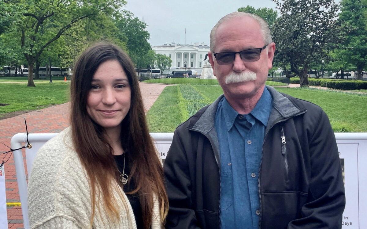 Released detainee Trevor Reed’s father Joey and his sister Taylor Reed pose for a photograph, while gathering with families of other detainees outside the White House on May 4, 2022. (Kevin Fogarty/Reuters)