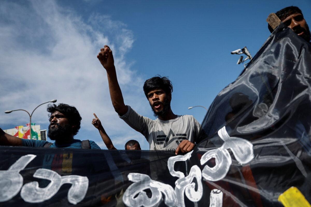 Protestors shout slogans during a protest demanding the resignation of Sri Lanka's acting President Ranil Wickremesinghe, in Colombo, Sri Lanka, on July 19, 2022. (Adnan Abidi/Reuters)