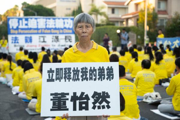 Xinhua Dong, a Falun Gong practitioner, attends a vigil in front of the Chinese Consulate in Los Angeles on July 18, 2022. (Debora Cheng/The Epoch Times)