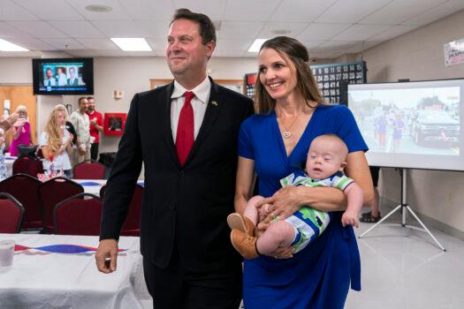 Dan Cox, candidate for the Republican gubernatorial nomination, along with his wife Valerie Cox, and their five-month-old boy, greet supporters during a primary election night event in Emmitsburg, Maryland, on July 19, 2022. (Nathan Howard/Getty Images)