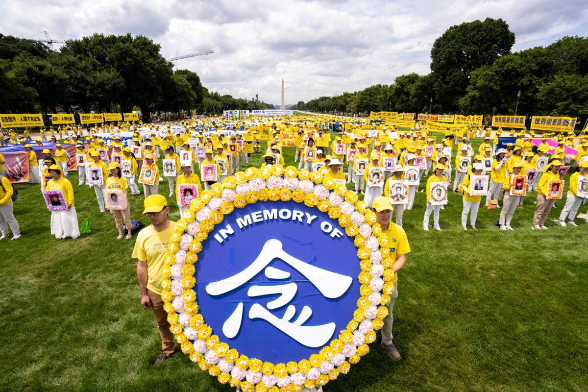 Falun Gong practitioners prepare to march down Pennsylvania Avenue to commemorate the 23rd anniversary of the Chinese Communist Party's persecution of the spiritual practice in China, in Washington on July 21, 2022. (Samira Bouaou/The Epoch Times)