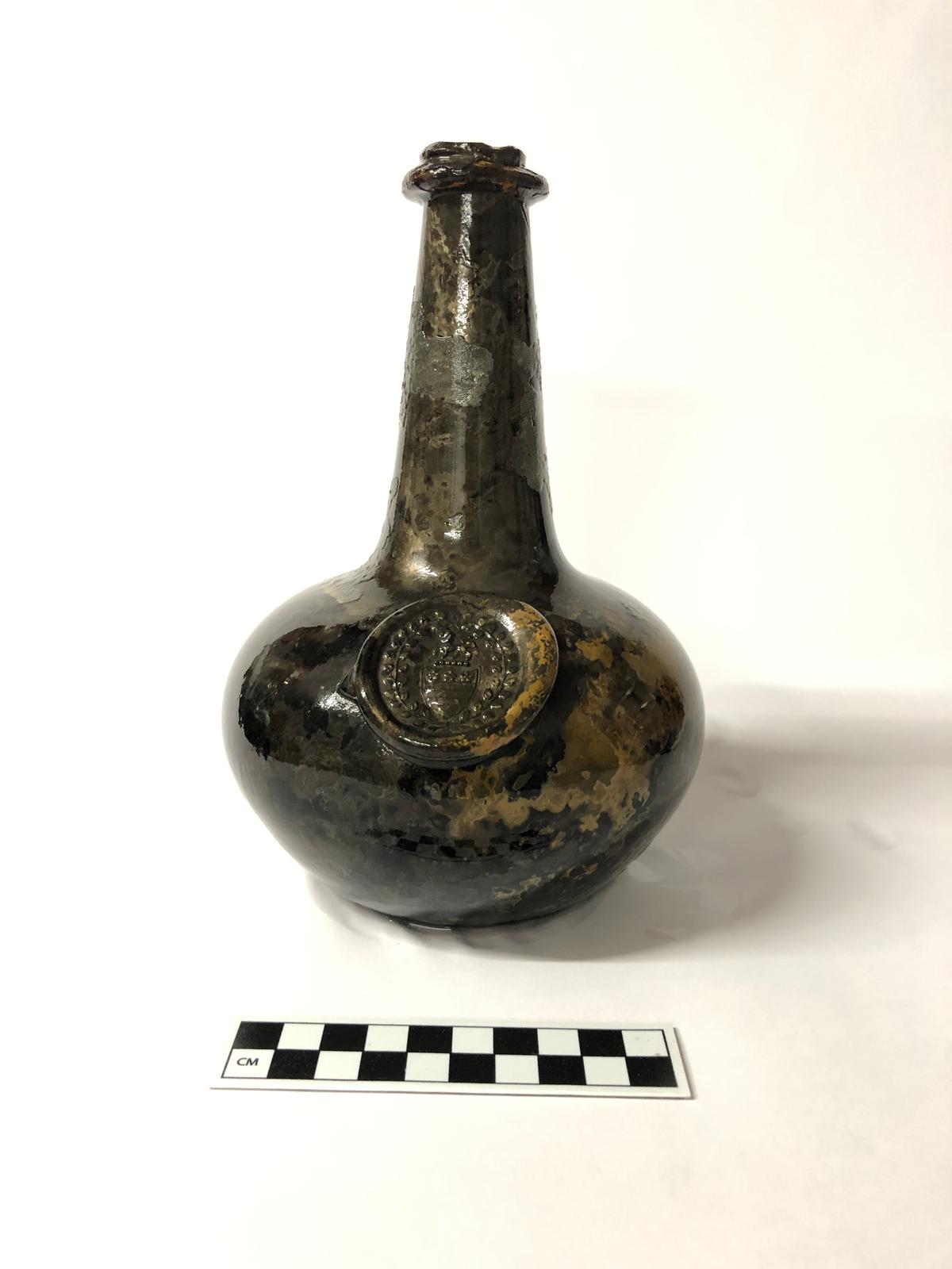 A wine bottle with the Washington family crest. (Courtesy of Norfolk Historic Shipwrecks)