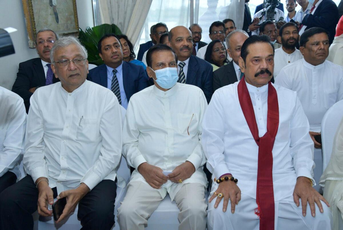 Lawmaker Lakshman Kiriella (L), former president Maithripala Sirisena (C), and former prime minister Mahinda Rajapaksa (R) attend the swearing in ceremony of Sri Lanka's newly elected president Ranil Wickremesinghe, in Colombo, Sri Lanka, on July 21, 2022. (Sri Lankan President's Office via AP)