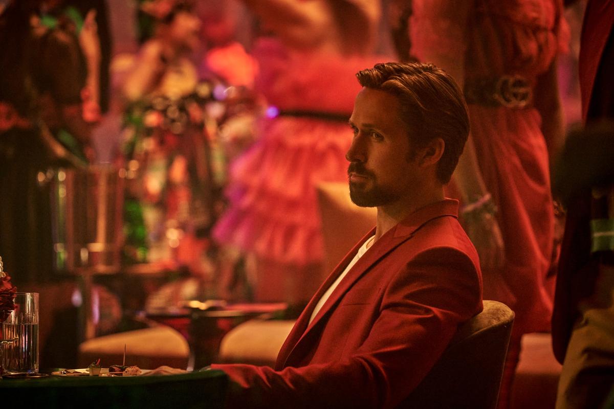 Court Gentry, call-sign "Sierra Six" (Ryan Gosling) wearing a red suit so he can ... <em>blend in ... </em>in "The Gray Man." (Paul Abell/Netflix)