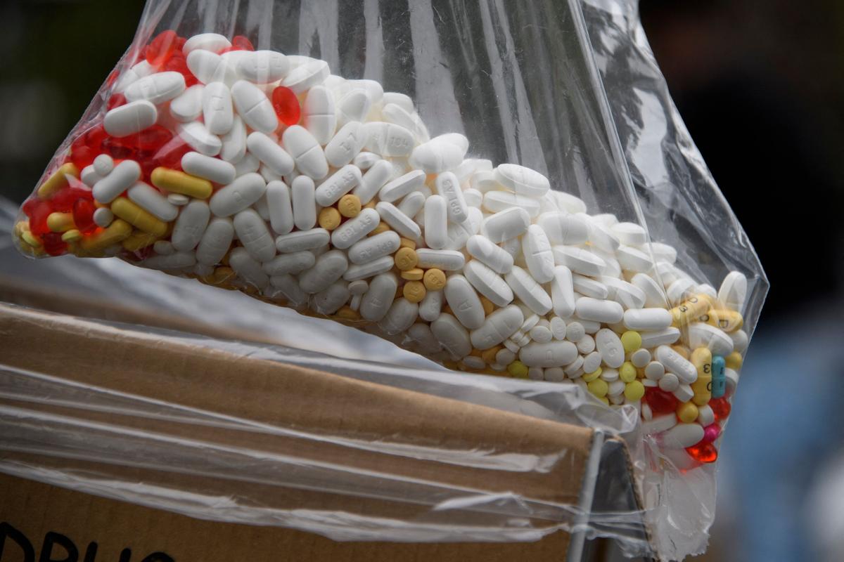 A bag of assorted pills and prescription drugs dropped off for disposal is displayed during the DEA 20th National Prescription Drug Take Back Day at Watts Healthcare on April 24, 2021, in Los Angeles, California. (PATRICK T. FALLON/AFP via Getty Images)