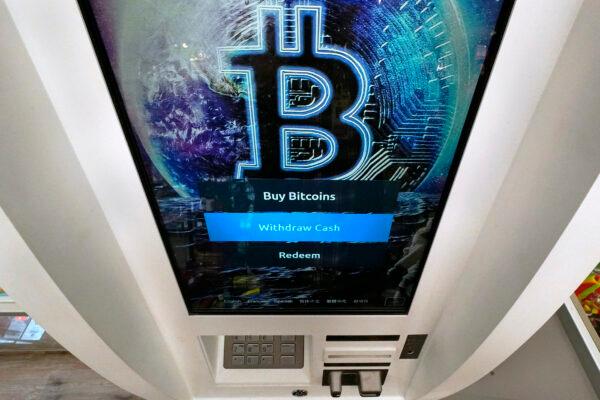 The Bitcoin logo appears on the display screen of a cryptocurrency ATM in Salem, N.H., on Feb. 9, 2021. (Charles Krupa/AP Photo)