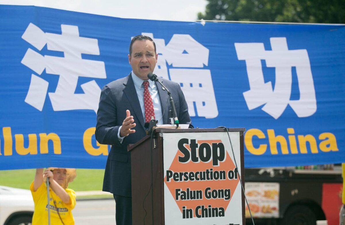 Andrew Bremberg, president of the Victims of Communism Memorial Foundation, speaks at a rally in Washington on July 21, 2022, calling for an end to the 23-year-long persecution of Falun Gong. (Lisa Fan/The Epoch Times)