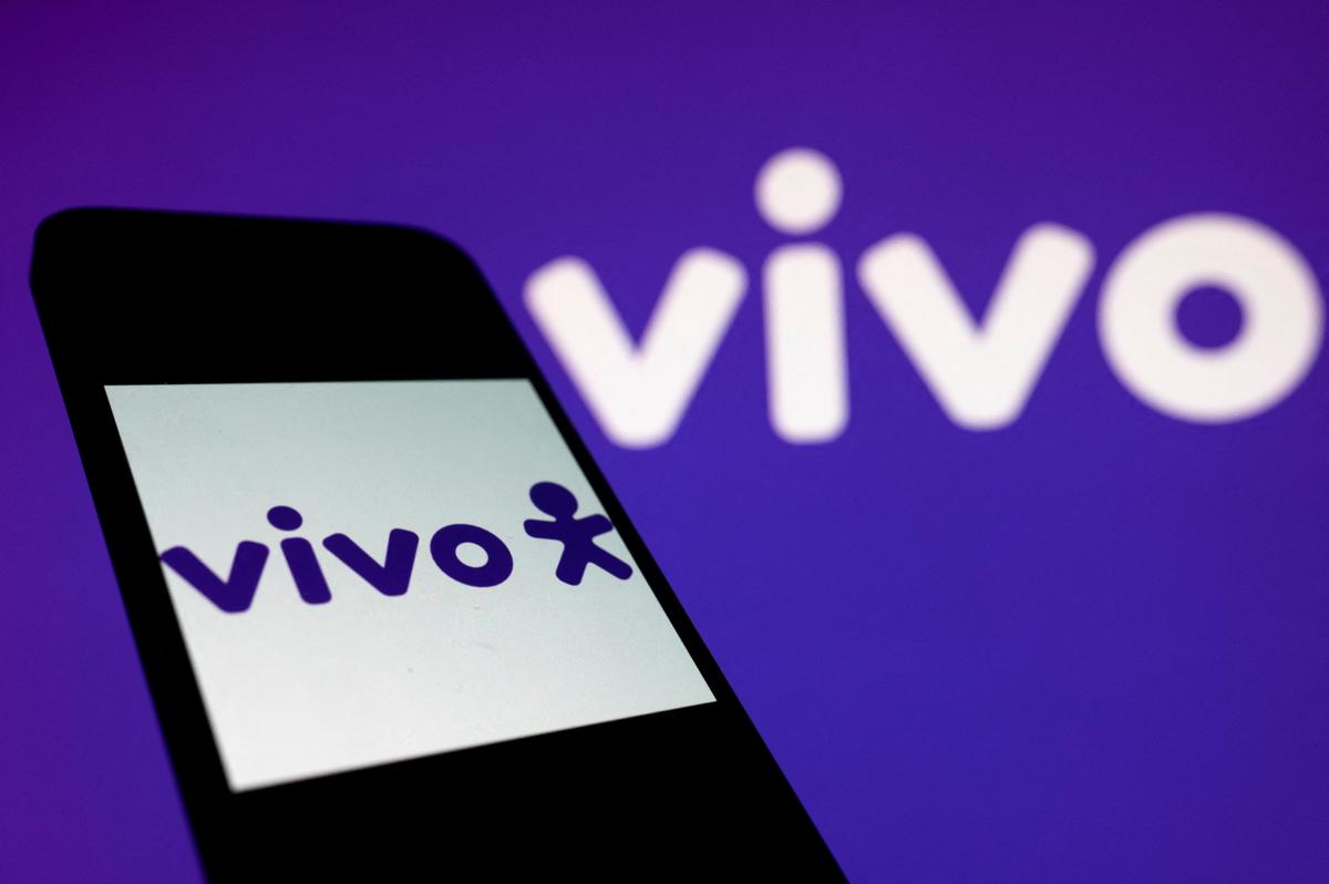 A smartphone screen displays the logo of Vivo telecom company on a Vivo website background in Rio de Janeiro, Brazil, on Nov. 3, 2021. (Mauro Pimentel/AFP via Getty Images)