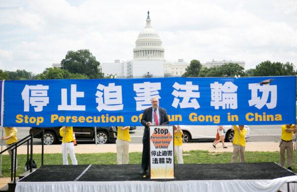Piero Tozzi, senior adviser to Rep. Chris Smith (R-N.J.), speaks at a rally to commemorate the 23rd anniversary of the launch of the Chinese regime’s persecution of spiritual group Falun Gong, held on the National Mall in Washington on July 21, 2022. (Lisa Fan/The Epoch Times)