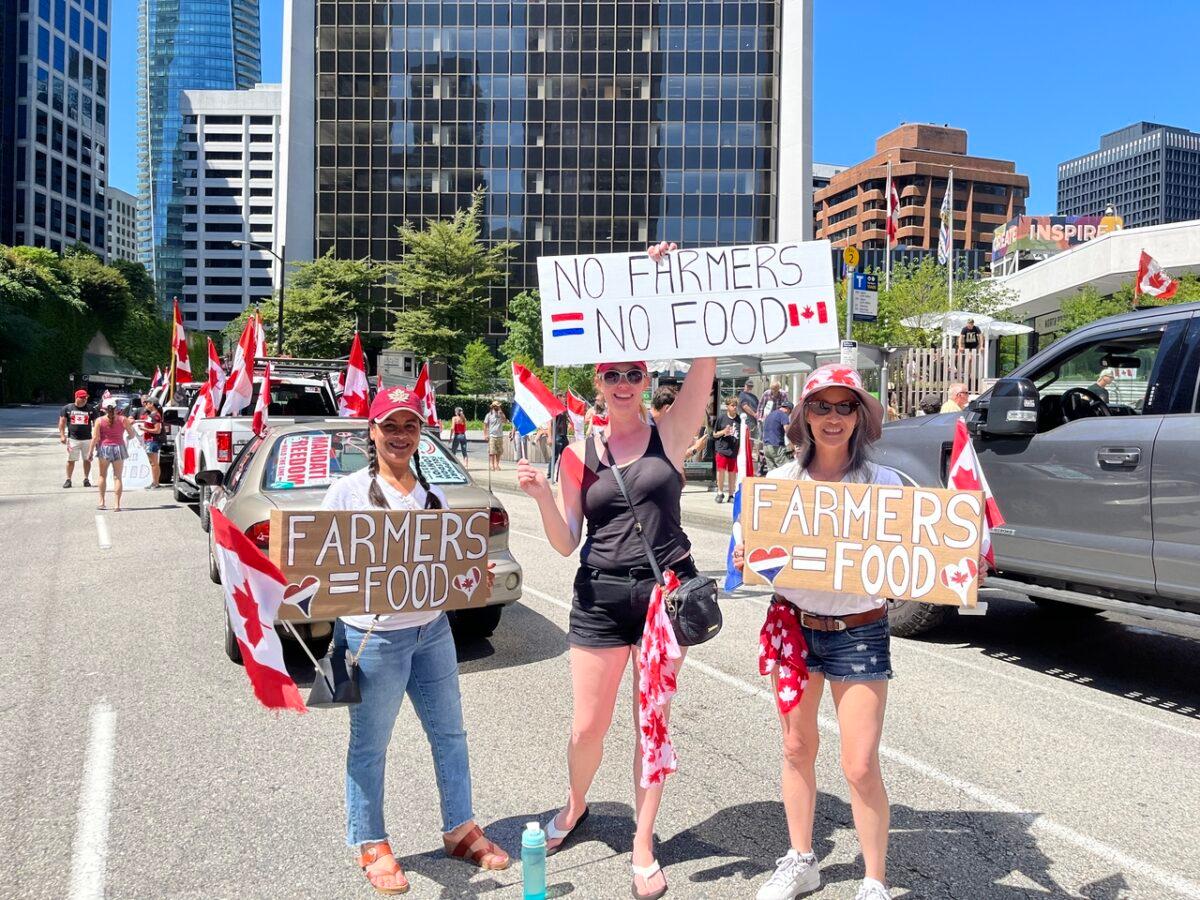 Women show support for Dutch farmers and protest for the government's climate-change measures at a rally in Vancouver, B.C., on July 23, 2022. (Vivian Yu/The Epoch Times)