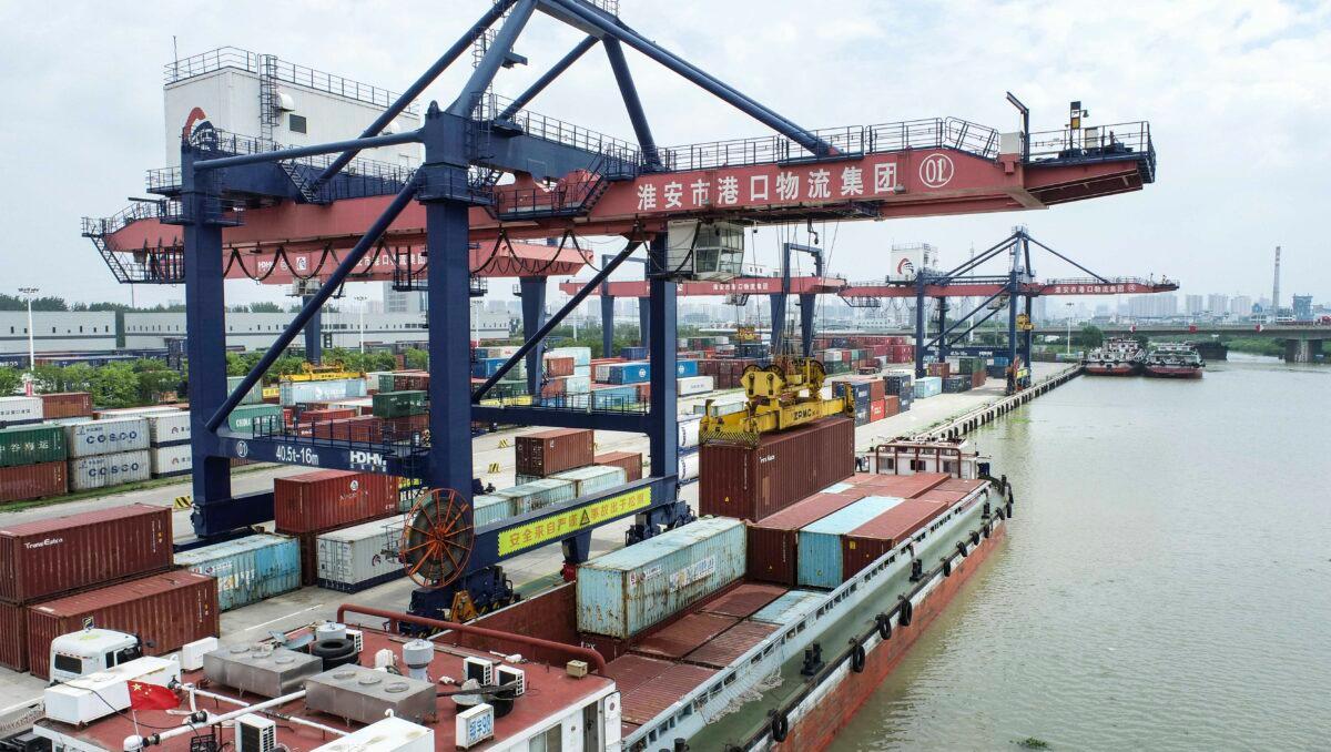Container hoisting operations are seen at Huai'an New Port in Huai'an, Jiangsu Province, China, on July 21, 2022. (CFOTO/Future Publishing via Getty Images)