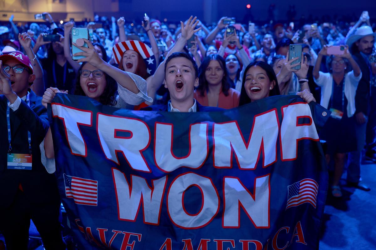 Young supporters cheer as former U.S. President Donald Trump arrives on stage during the Turning Point USA Student Action Summit held at the Tampa Convention Center in Tampa, Fla., on July 23, 2022. (Joe Raedle/Getty Images)