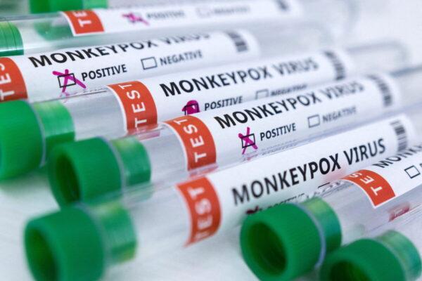 Test tubes labeled "Monkeypox virus positive and negative" in a photo illustration taken on May 23, 2022. (Dado Ruvic/Reuters)