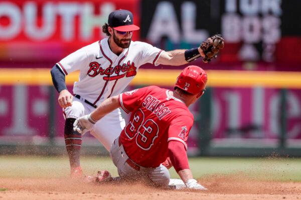 Los Angeles Angels' Max Stassi (33) beats the tag from Atlanta Braves shortstop Dansby Swanson, left, as he slides into second base during the third inning of a baseball game, in Atlanta, on Sunday, July 24, 2022. (Butch Dill/AP Photo)